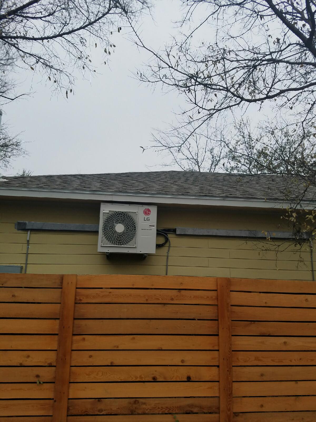 Outside of a home with a split AC mounted