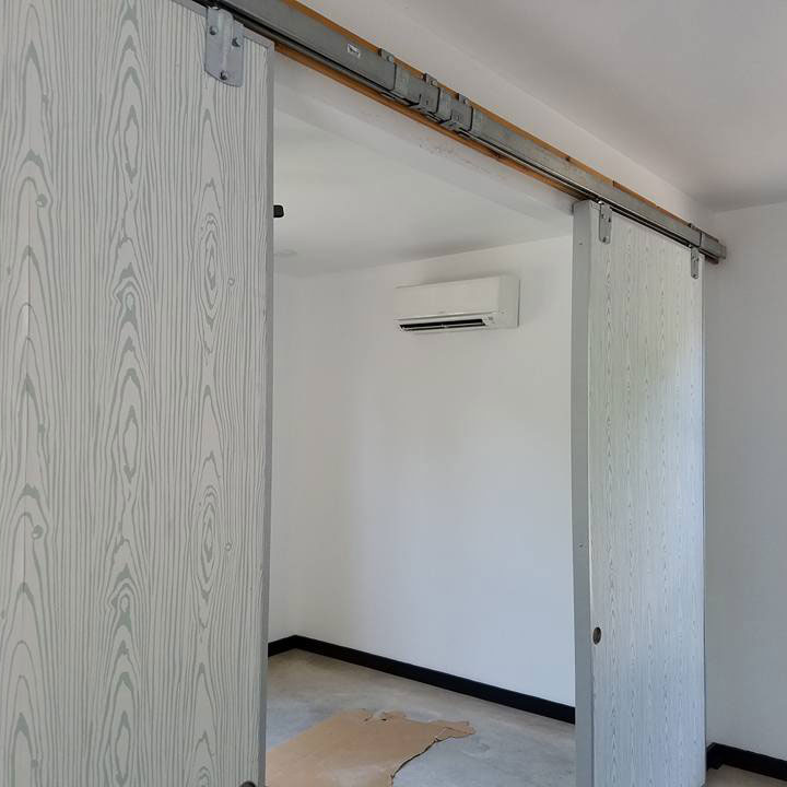 Doorway looking through to air conditioner unit